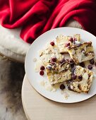 Plate of almond croissant slices with white chocolate sauce