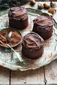 Three rum and raisin cakes with chocolate icing for Christmas