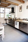 Kitchen counter with stainless steel doors in rustic ambiance