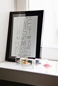 Framed message on window sill