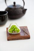 Wagashi pine (watsu) with a pot of tea (Japan)