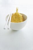 Tempura prawn in a bowl with chopsticks (Japan)