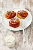 Blinis with smoked salmon, pickled gherkins and onions