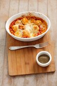 Spaghetti with turkey meatballs and tomato sauce, topped with cheese and baked