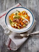 Ribbon pasta with squash, venus clams and olives
