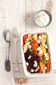 Oven-roasted vegetables with feta and olive oil (view from above)
