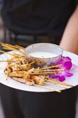 A Platter of Shrimp Skewers with a Yogurt Dip