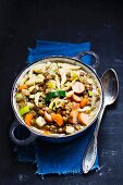 Lentils with spaetzle, sausage and carrots