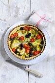 Vegetable tart with broccoli, tomatoes and olives