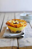 Sweet damson cake in a glass dish