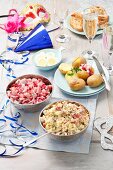 Party buffet with herring salad and accompaniments