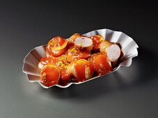 Currywurst in a cardboard tray