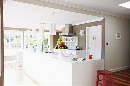 Open kitchen with white kitchen unit and fruit bowl
