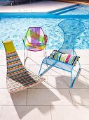 Various, colorful outdoor chairs by the pool