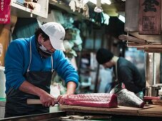 Fish being prepared at Tokyo fish market