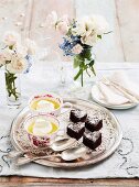 Brownie hearts and custard topped with cream