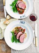 Roast lamb with mange tout and tomatoes, for two