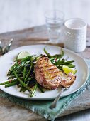 Grilled tuna steak with green beans, wasabi and sesame seeds