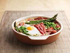 Baked eggs red pepper asparagus peas and chorizo
