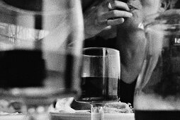 Woman at the table with wine glasses