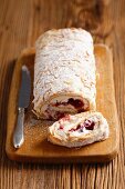 Sponge roll with cranberry jam and cream