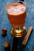 Carrot juice with apple, cinnamon and hazelnuts