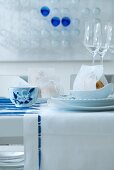Festive place setting in white and blue