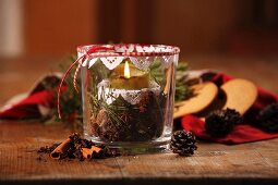 Hand-crafted candle lantern with festive spices