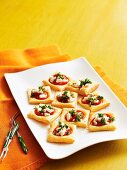Tomato and goats cheese puff pastry tartlets