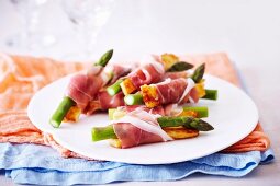 Green asparagus and fried Halloumi cheese wrapped in ham