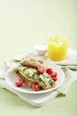 An egg white omelette with spinach and ricotta on a whole-grain roll