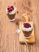 Chocolate mousse with cream and cranberries