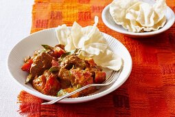 Lamb curry with tomatoes and basil