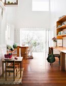 Light-filled dining room with play area and desk