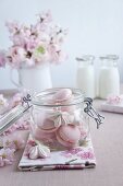 Pink macaroons and flower-shaped meringues