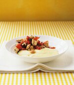Mediterranean chicken stew with creamy polenta