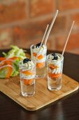 Smoked salmon with cream and caviar served in shot glasses