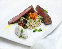 Beef steak with pearl barley and vegetables