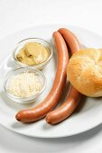 Hot dog sausages with horseradish, mustard and a bread roll