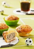 Cheese muffins filled with minced meat for a football-themed party