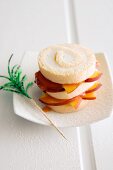 Bellini cake made with Swiss roll slices and peaches