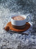 Cup of hot chocolate with a milk chocolate praline