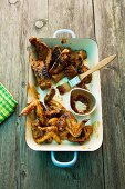 Grilled chicken wings and spare ribs with passion fruit sauce