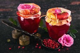Two jars of rose petal jelly with cranberries