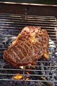 Barbecued beef steak on the barbecue