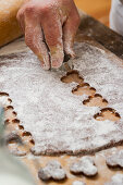 A confectioner cutting out biscuits