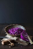 Freshly sliced red cabbage in a wooden bowl