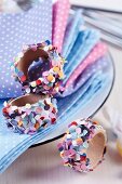 Wooden napkin rings decorated with colourful confetti