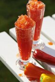 Pepper granita in sundae glasses with various pointed peppers