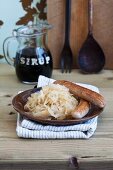 Sauerkraut with sugar beet syrup and sausages